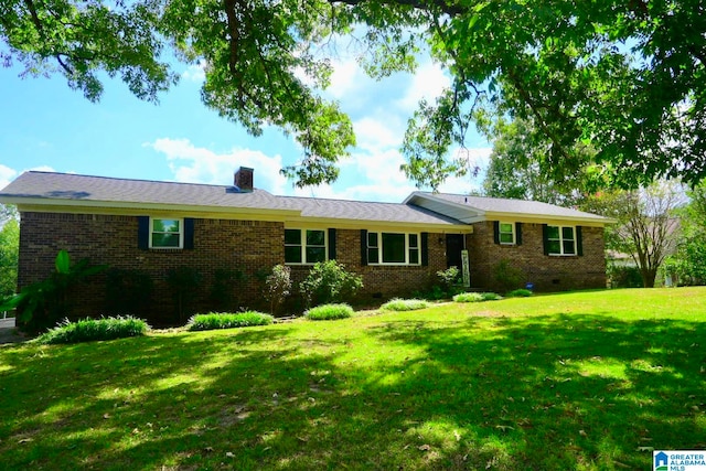 ranch-style home with a front lawn