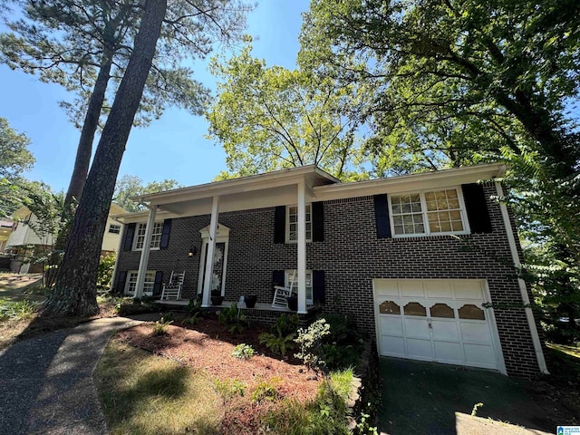 view of front of property featuring a porch and a garage