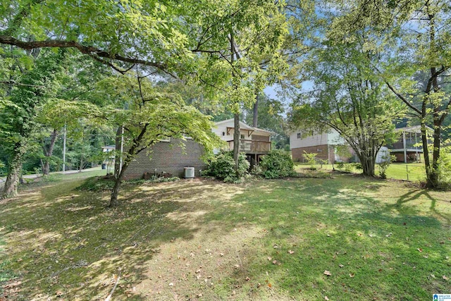 view of yard with a wooden deck