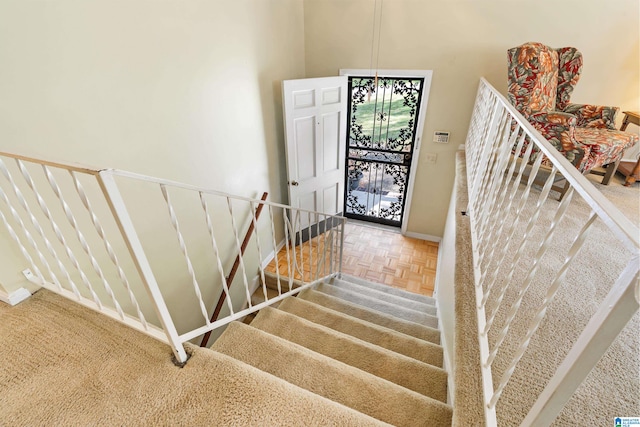 stairway with parquet floors