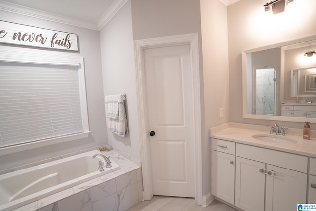 bathroom with vanity, ornamental molding, and shower with separate bathtub