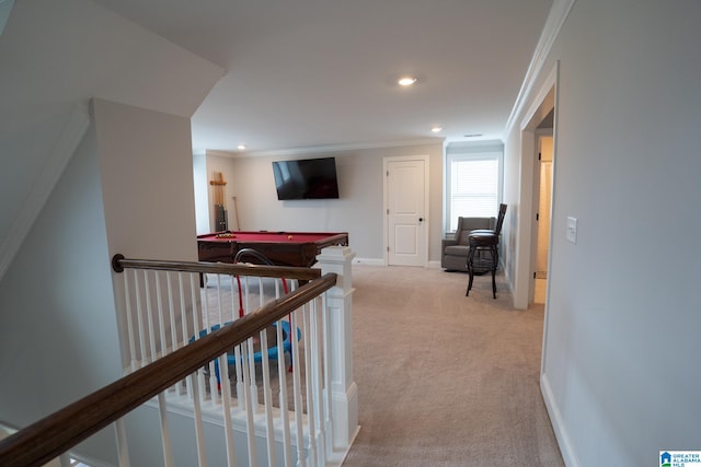 corridor featuring light carpet and ornamental molding