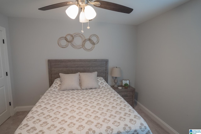 bedroom with ceiling fan and light carpet