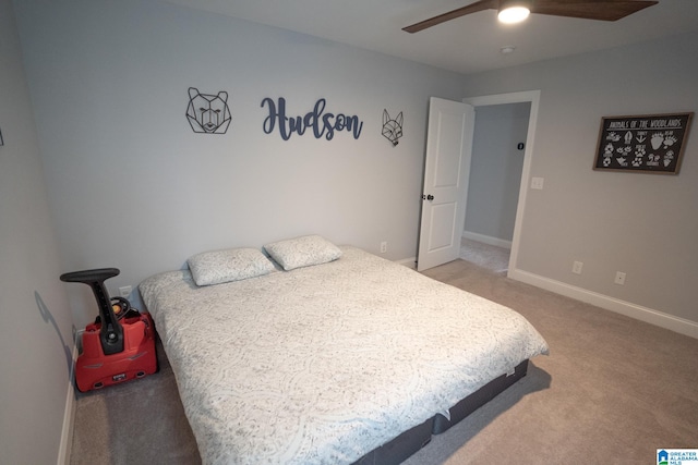 carpeted bedroom featuring ceiling fan