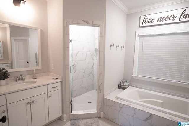 bathroom featuring plus walk in shower, vanity, and crown molding