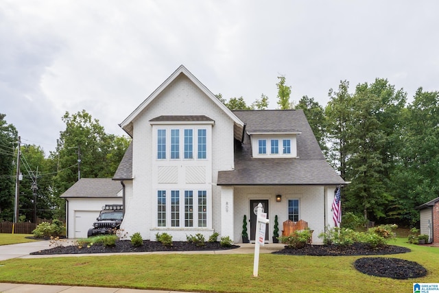 view of front of home featuring a garage and a front yard