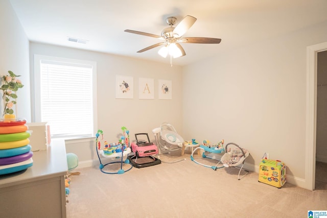 rec room featuring ceiling fan and light colored carpet