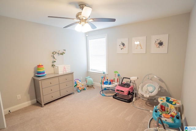 recreation room with light colored carpet and ceiling fan