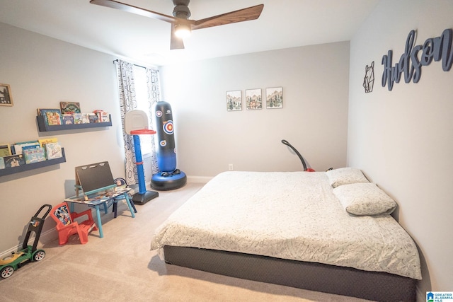 carpeted bedroom with ceiling fan