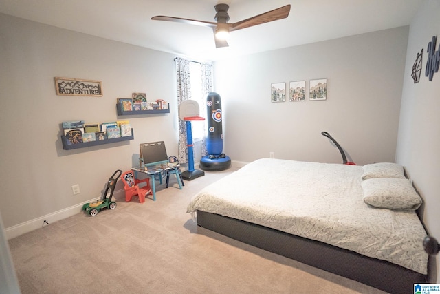 bedroom featuring ceiling fan and carpet