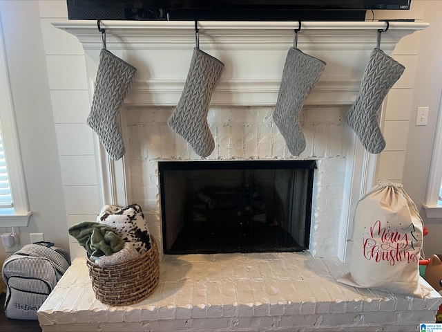 details featuring a brick fireplace