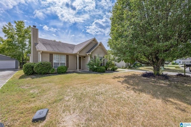 view of front facade featuring a garage and a front lawn