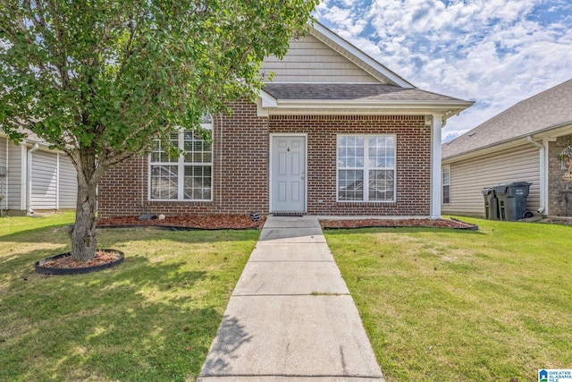 bungalow featuring a garage and a front yard