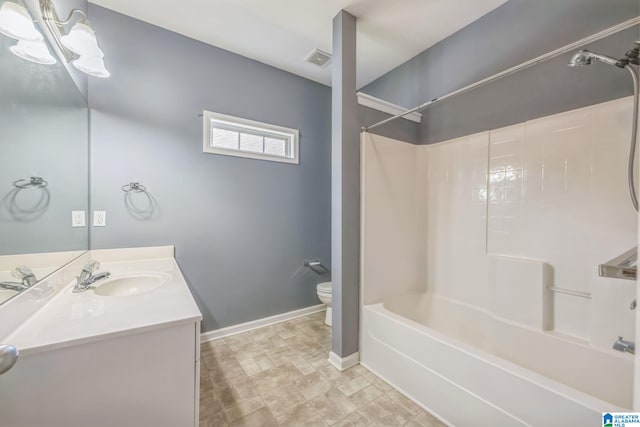 full bathroom featuring washtub / shower combination, toilet, and vanity