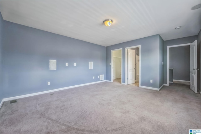 unfurnished bedroom featuring light colored carpet