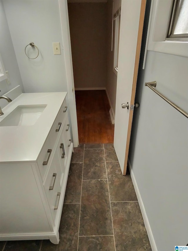 bathroom with vanity and wood-type flooring