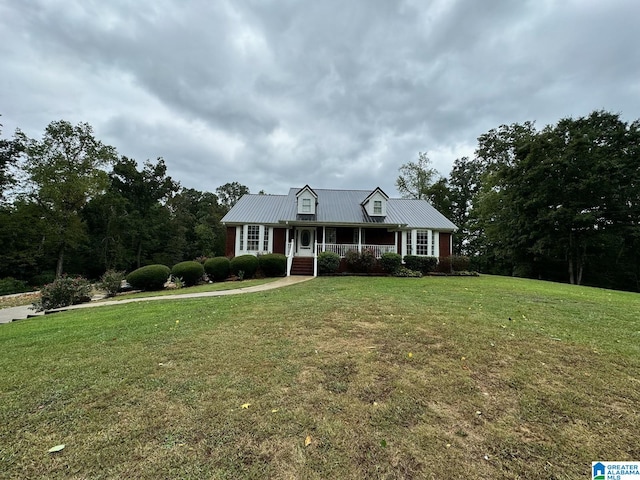 view of front of property with a porch and a front lawn