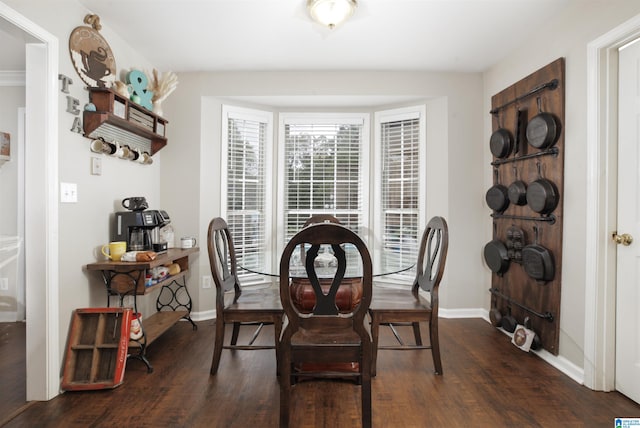 dining space featuring dark hardwood / wood-style flooring