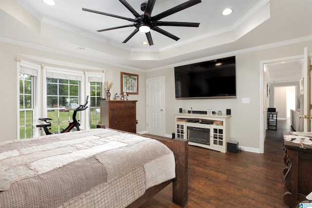 bedroom with ornamental molding, dark hardwood / wood-style flooring, and ceiling fan