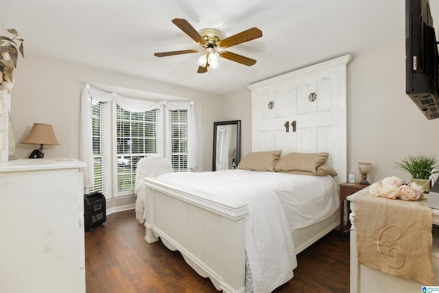 bedroom with dark wood-type flooring and ceiling fan