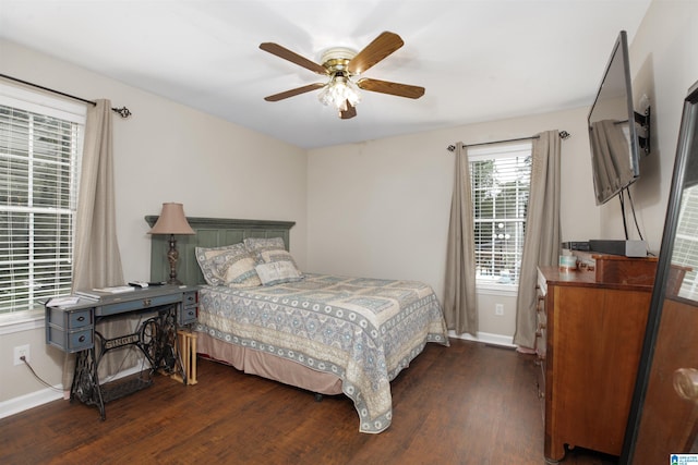 bedroom featuring ceiling fan and dark wood-type flooring