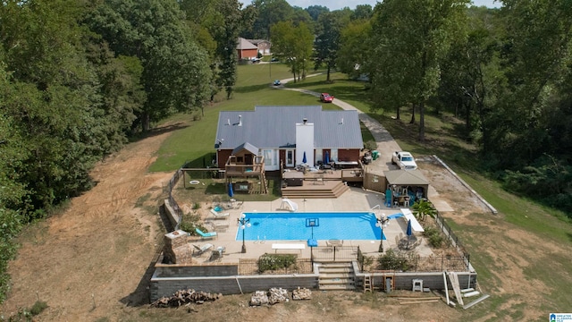 view of swimming pool with a deck