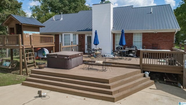 exterior space featuring a patio area and a hot tub