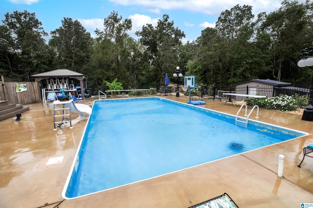 view of pool featuring a patio, a gazebo, and a water slide