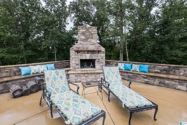 view of patio with an outdoor stone fireplace