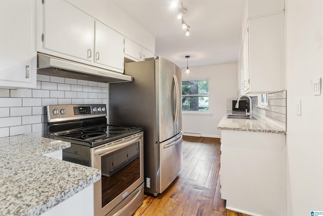 kitchen featuring hanging light fixtures, hardwood / wood-style flooring, white cabinetry, sink, and stainless steel range with electric stovetop