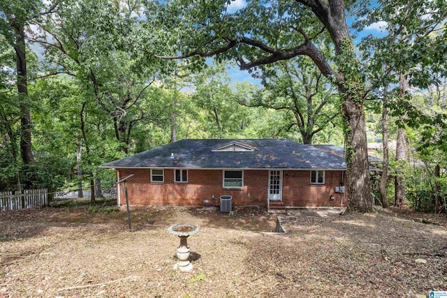 rear view of house featuring central AC unit