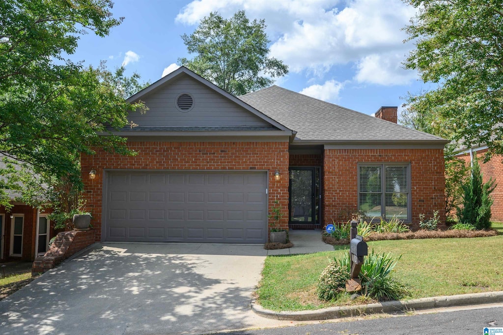 view of front facade with a garage and a front yard