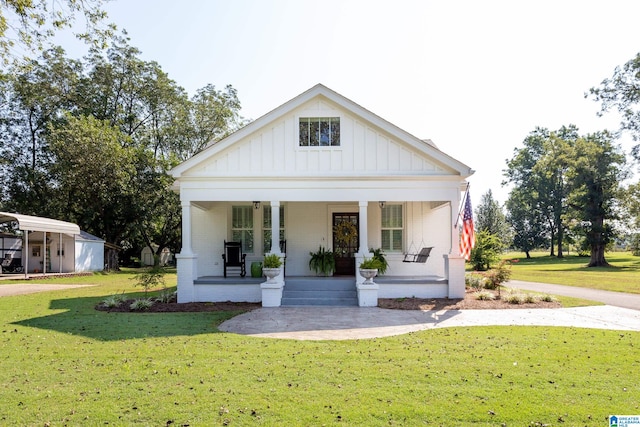 view of front of property with a porch and a front yard