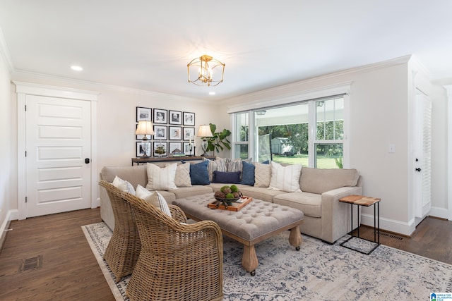 living room featuring crown molding, dark hardwood / wood-style flooring, and an inviting chandelier