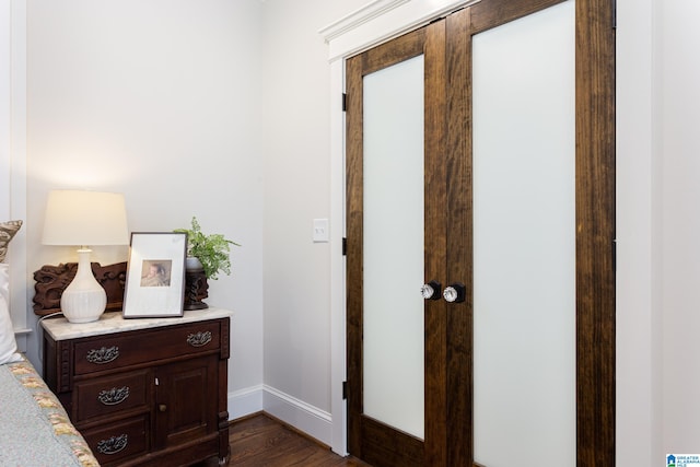 hall with dark wood-type flooring