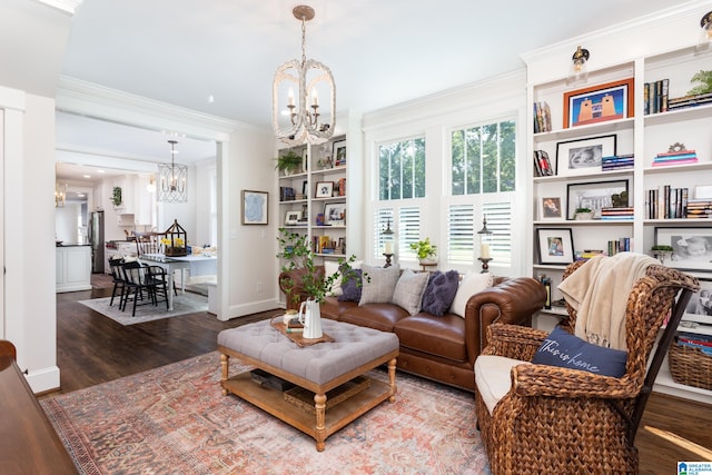 living room featuring ornamental molding, dark wood-type flooring, and a chandelier