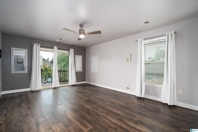 unfurnished room featuring dark hardwood / wood-style floors and ceiling fan