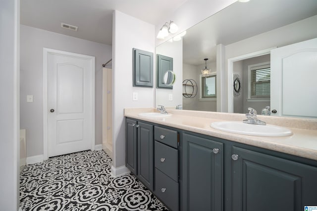 bathroom with tile patterned flooring, vanity, and a shower with shower curtain