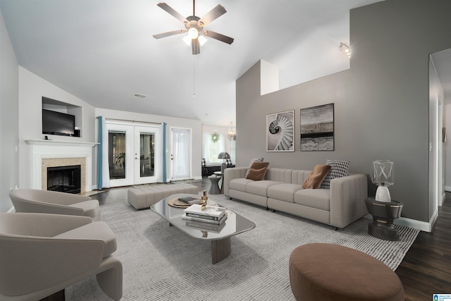 living room with wood-type flooring, a fireplace, high vaulted ceiling, and ceiling fan