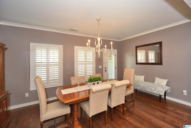 dining space with ornamental molding, dark wood-type flooring, and a chandelier