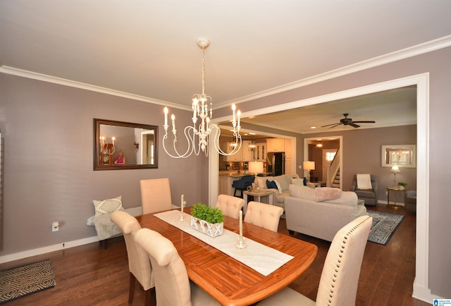 dining area featuring dark wood-type flooring, ceiling fan with notable chandelier, and crown molding