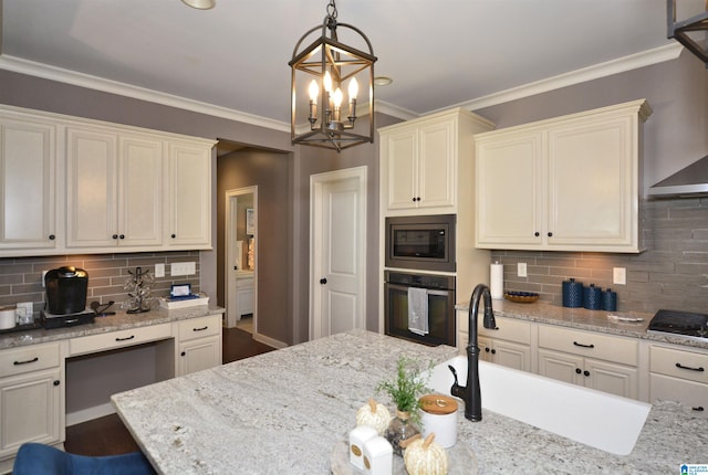 kitchen featuring a notable chandelier, crown molding, decorative light fixtures, stainless steel appliances, and decorative backsplash