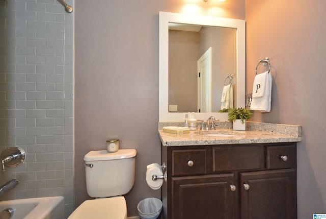 full bathroom with vanity, toilet, and tiled shower / bath combo