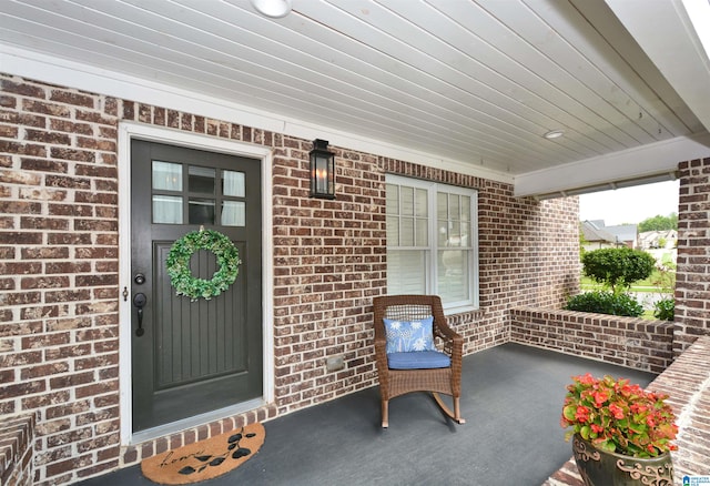 doorway to property with a porch