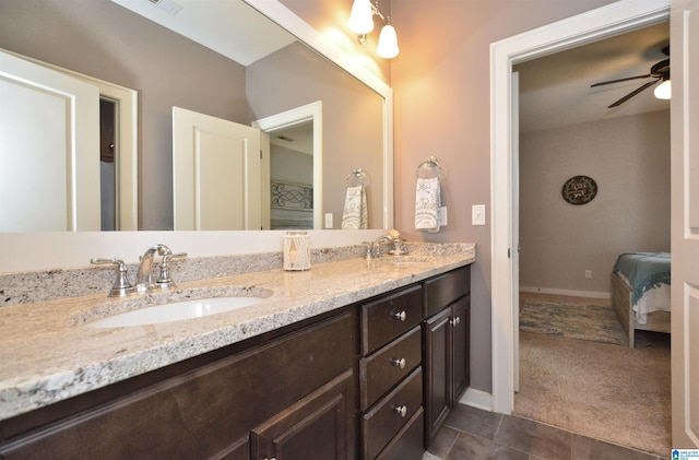 bathroom featuring vanity, ceiling fan, and tile patterned flooring