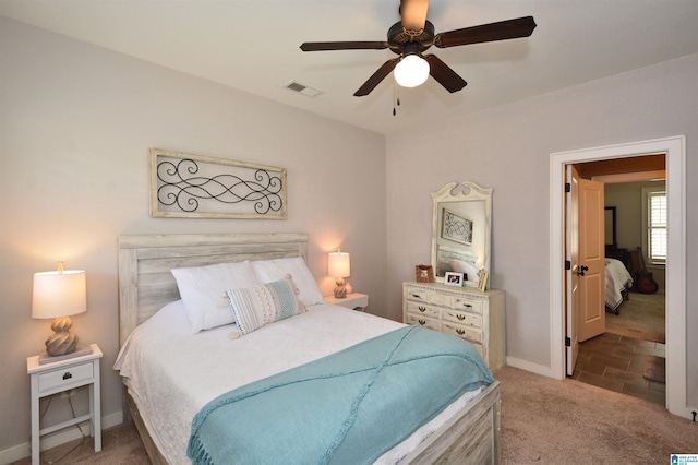 bedroom featuring ceiling fan and carpet