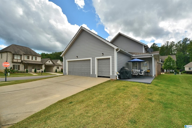 view of front of property with a front yard and a garage