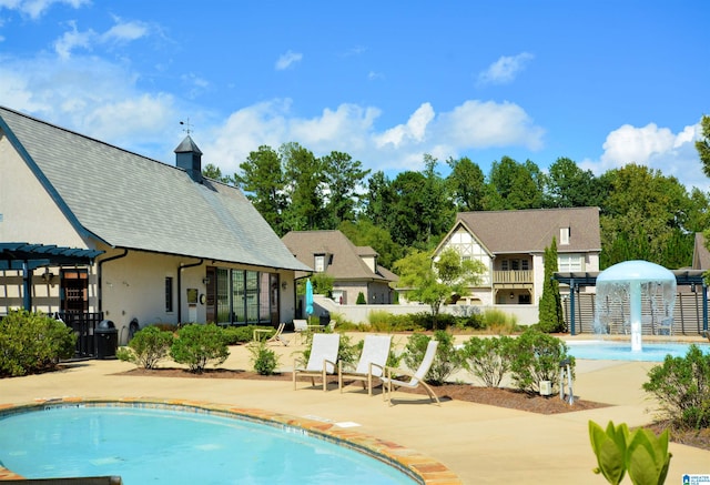 view of pool with a pergola and a patio