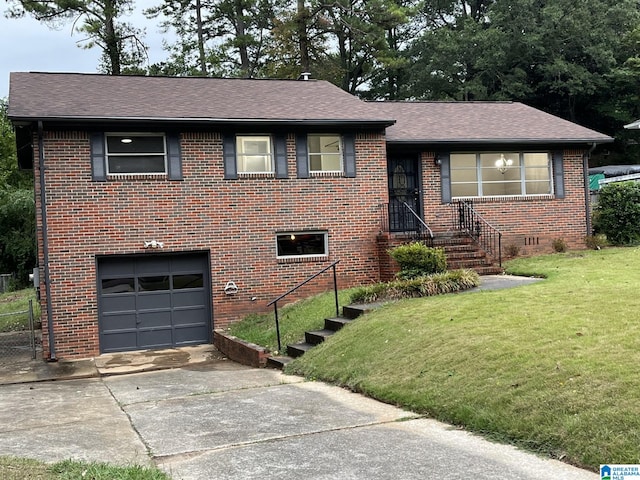 view of front of home featuring a garage and a front lawn