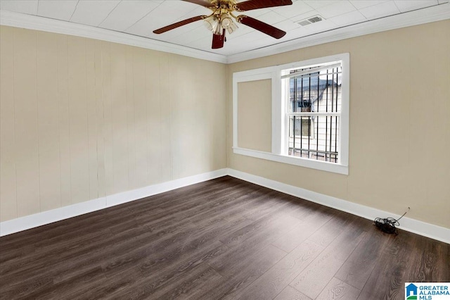 spare room featuring ceiling fan, dark hardwood / wood-style floors, and crown molding